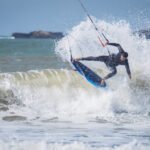 professional kitesurfer catching a wave in Essaouira Morocco by Susan Paige photography