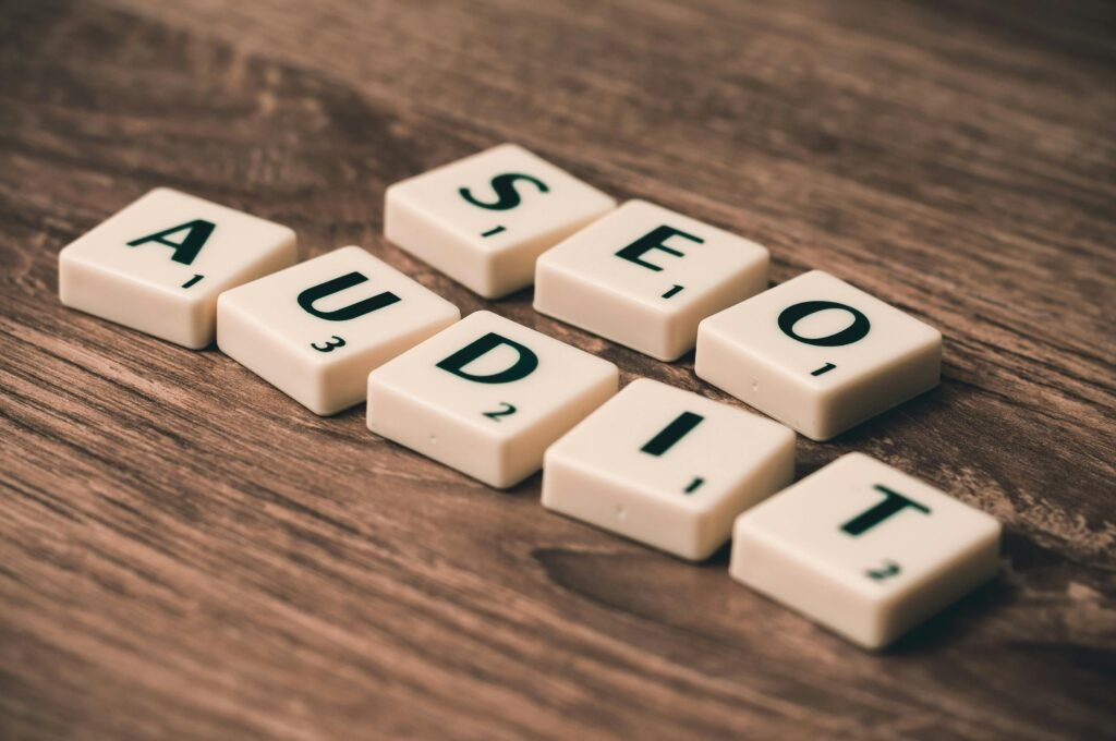 SEO AUDIT written in scrabble letters on wooden table