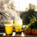 moroccan tea lifestyle photography for Living Essaouira in Essaouira Morocco of steaming tea while tea pours into cup typical of moroccan tea