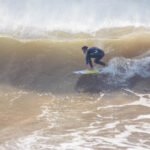 Moroccan Surfer catching a barrel wave near Essaouira, Morocco